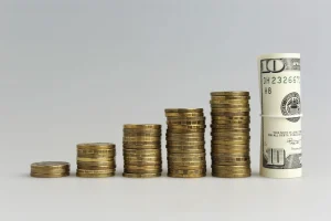 A stack of coins representing ROI of HybridHero’s hybrid workplace management platform