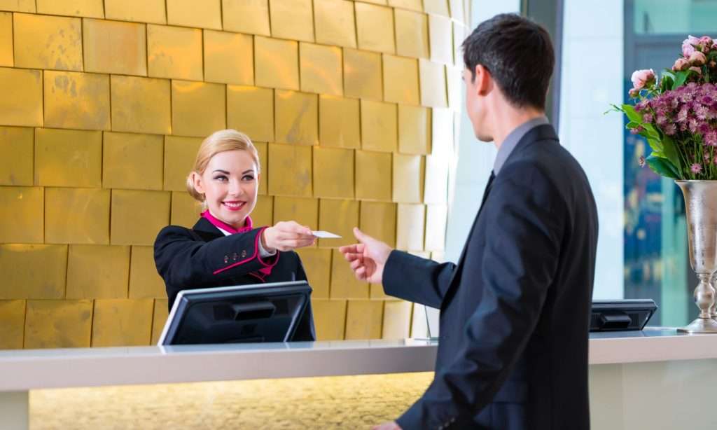Front desk visitor check-in graphic for HybridHero’s visitor management platform