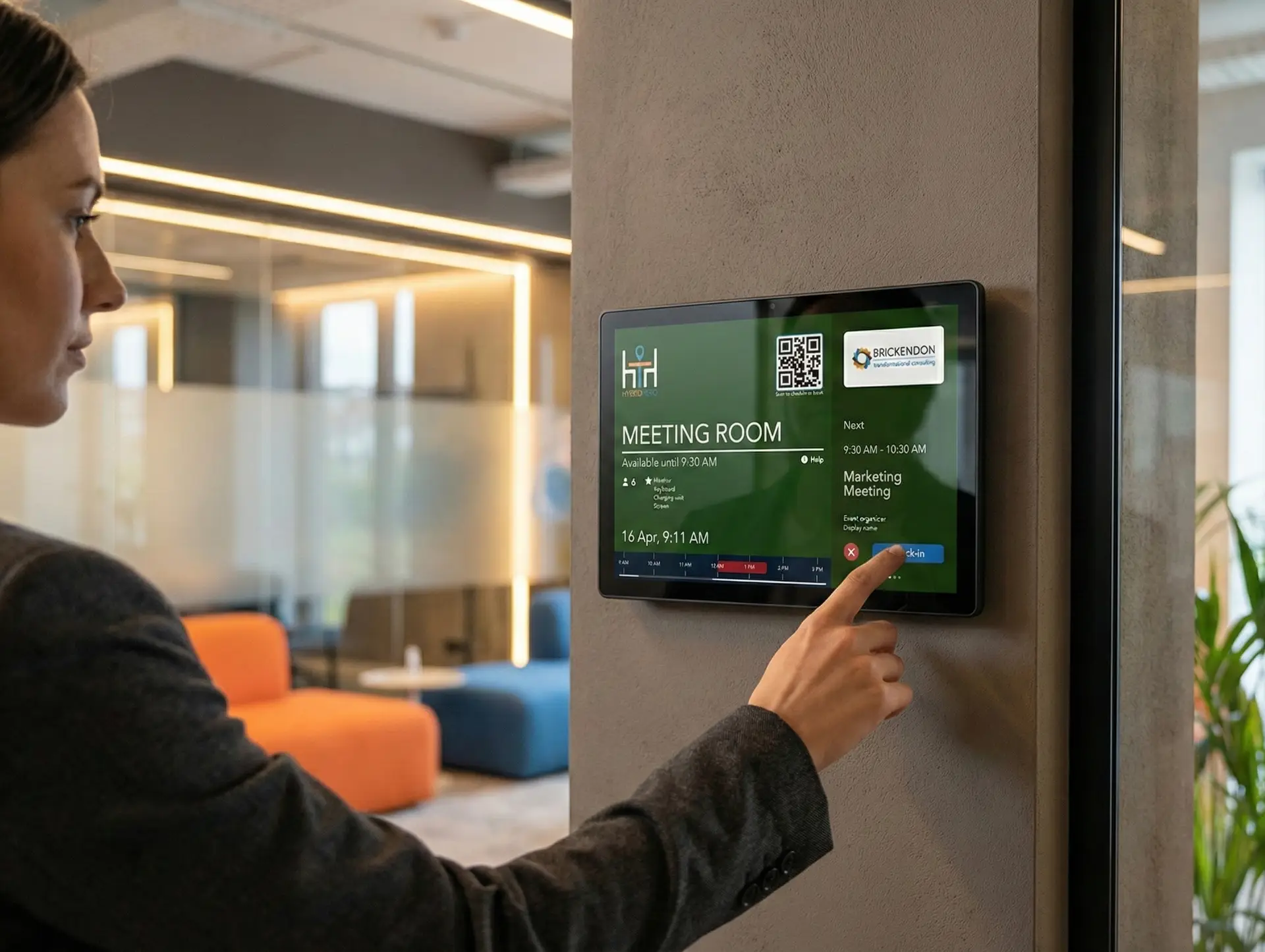 Modern meeting room with booking display panel showing availability and scheduling