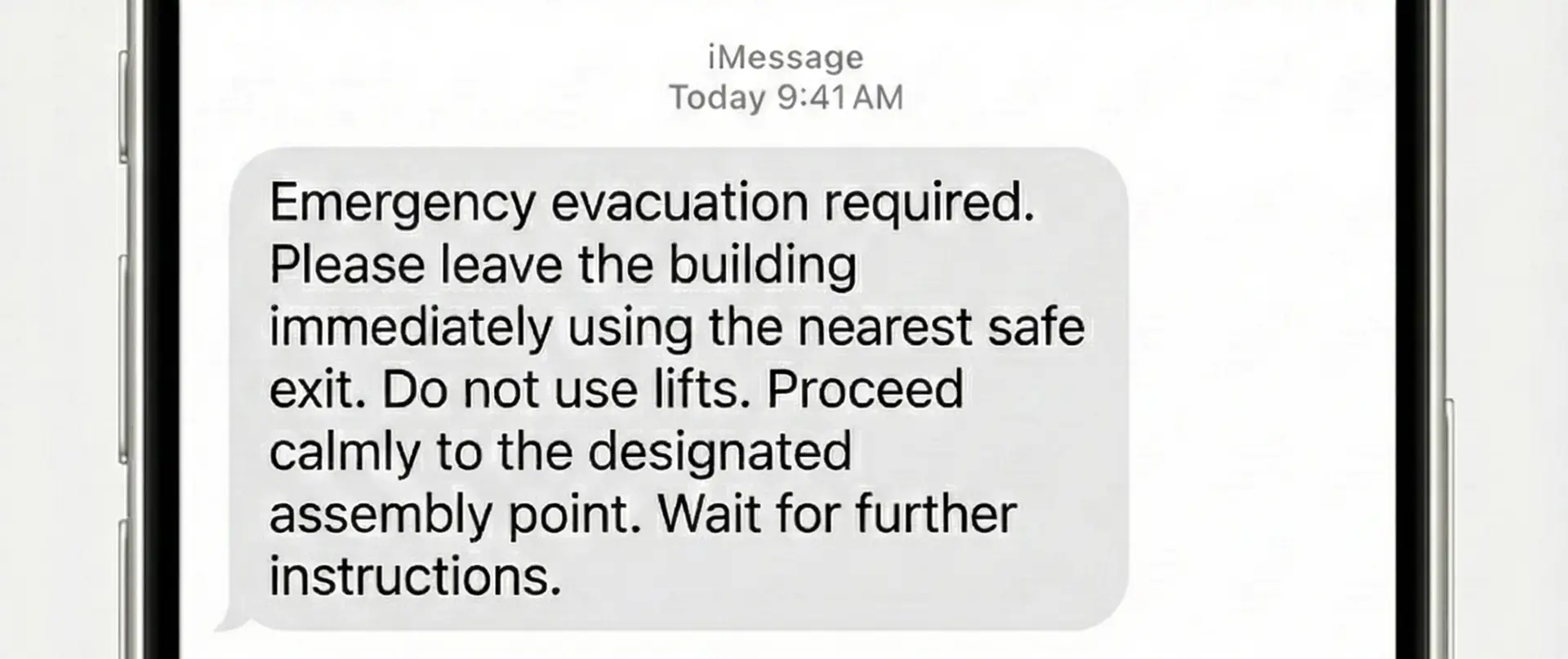 Mobile phone showing an urgent evacuation alert sent by workplace safety software